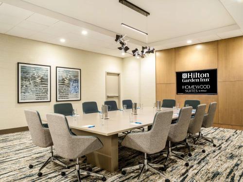 a conference room with a long table and chairs at Homewood Suites By Hilton Toledo Downtown in Toledo