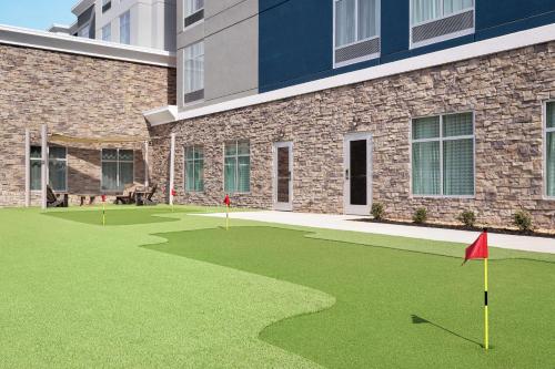 a golf course in front of a building at Homewood Suites By Hilton Mcdonough in McDonough