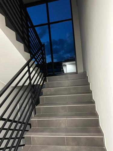 a set of stairs in a building with a window at Premium Apartament Polna Szczecinek in Szczecinek