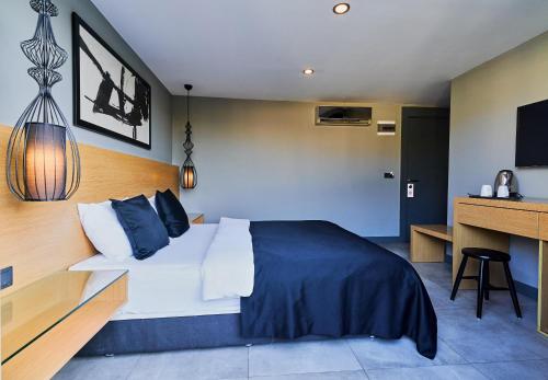 a bedroom with a large bed and a desk at Loft 1502 in Antalya