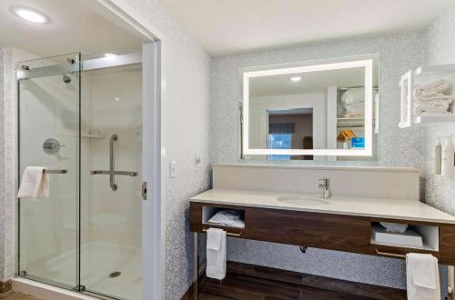 a bathroom with a sink and a shower at Hampton Inn Colorado Springs Northeast in Colorado Springs