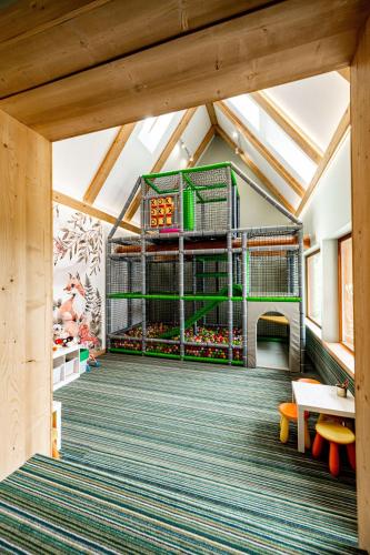 a childrens play area in a building with a playground at Ku Dolinie in Kościelisko
