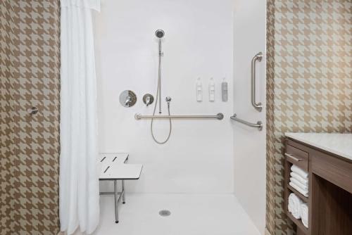 a bathroom with a shower with a shower curtain at Home2 Suites By Hilton Wildwood The Villages in Wildwood