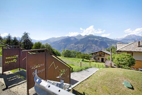 a boat is sitting on the grass next to a building at Maison Grange 4 in Pila