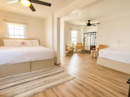 a bedroom with two beds and a living room at Beachliner Hotel in Ocean Grove