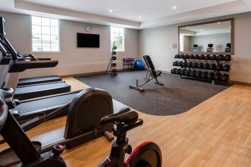 a gym with exercise equipment and a mirror at Hilton Garden Inn St Augustine-Historic District in Saint Augustine