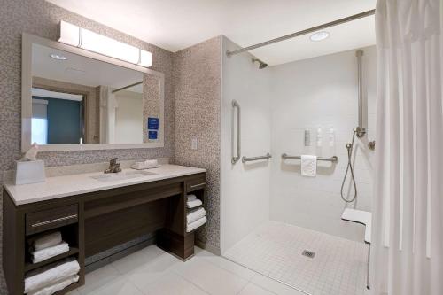 a bathroom with a sink and a shower at Home2 Suites By Hilton Lakewood Ranch in Bradenton