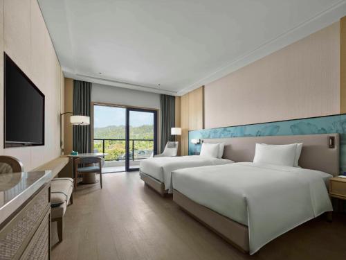 Cama o camas de una habitación en Doubletree By Hilton Taizhou Shenxianju