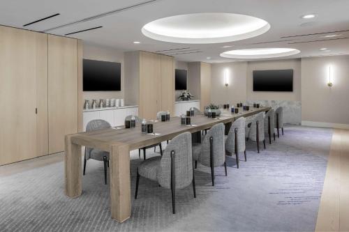 a large conference room with a long table and chairs at The Morrow Washington Dc, Curio Collection By Hilton in Washington