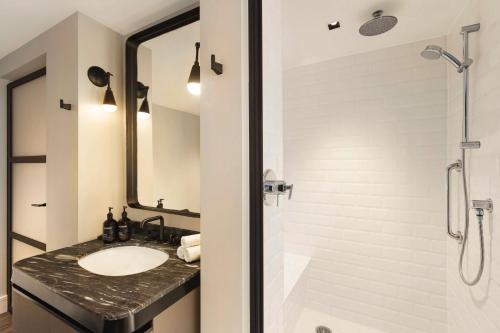 a bathroom with a sink and a shower at Canopy by Hilton San Francisco SoMa in San Francisco