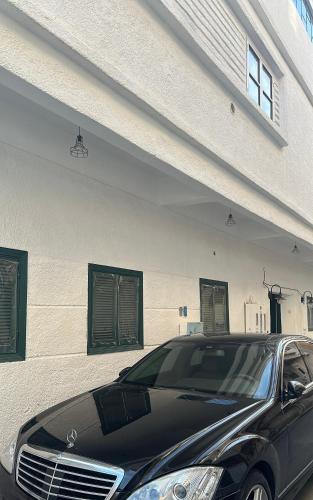 a black car parked in front of a building at Dar Sayang in Taif