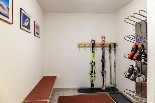 a room with skis hanging on the wall at Haus Alpenheim Apartment 3 in Tux