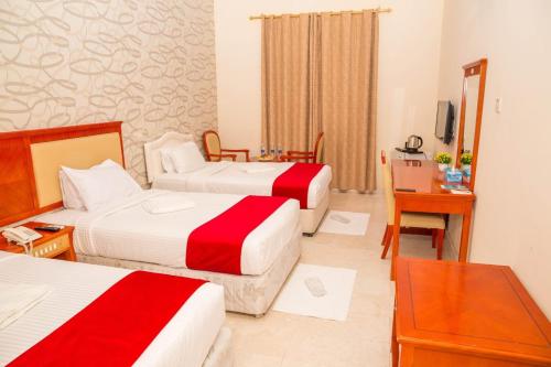 Postel nebo postele na pokoji v ubytování Al Jabal Hotel