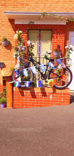 a bike parked on the side of a house at Marina & Seagulls in East Cowes