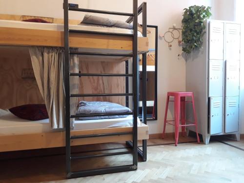 a couple of bunk beds in a room at 5 Terre Backpackers City in La Spezia
