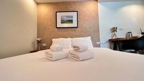 Postel nebo postele na pokoji v ubytování UDEE Cozy Hotel