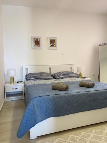 a bedroom with two beds with pillows on it at D&M APARTMENTS in Rab