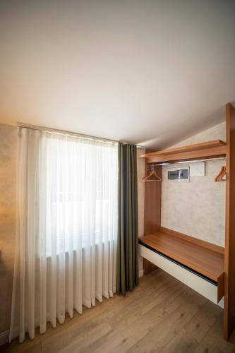 Postel nebo postele na pokoji v ubytování MELL City Suites Hotel