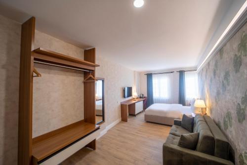 Postel nebo postele na pokoji v ubytování MELL City Suites Hotel