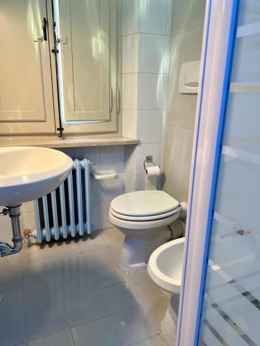 a bathroom with a toilet and a sink at Residenza del Duca in Senigallia