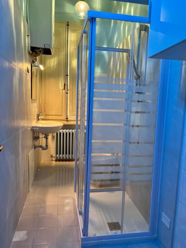 a glass shower in a bathroom with stairs at Residenza del Duca in Senigallia