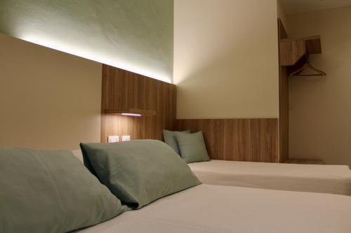 Postel nebo postele na pokoji v ubytování Albergo Degli Amici