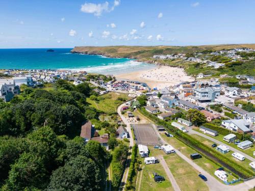 an aerial view of a town with a beach at Baywatch Sands in Wadebridge