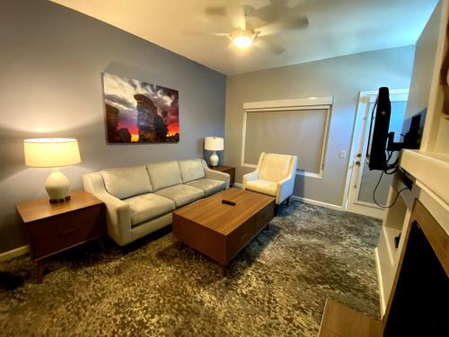 a living room with a couch and a table and a tv at WorldMark Rancho Vistoso in Oro Valley