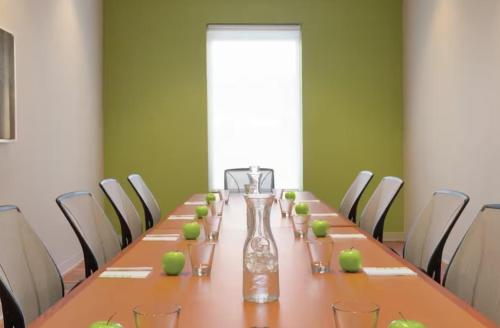 a long table with apples on it in a room at Home2 Suites By Hilton Dalton in Dalton