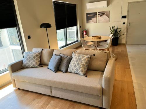 a living room with a couch and a table at Morgado da Granja in Aveiro