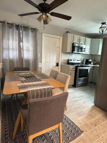 a kitchen with a table and a ceiling fan at Minutes away from Clearwater beach in Clearwater