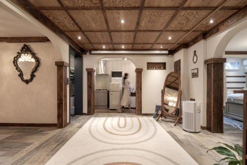 a room with a rug on the floor and a mirror at Jeonju Hanok Village, Maison14 in Jeonju