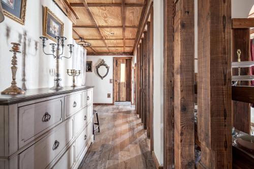 a kitchen with a wooden ceiling and a dresser at Jeonju Hanok Village, Maison14 in Jeonju