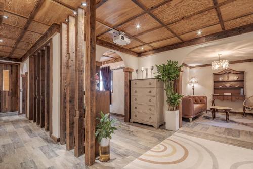 a living room with a wooden ceiling at Jeonju Hanok Village, Maison14 in Jeonju