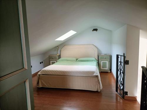 a bedroom with a bed and two night stands at Un passo dal mare e dalla città. in Cagliari