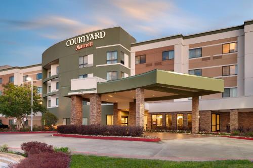 a rendering of the front of a hotel at Courtyard by Marriott Houston NASA Clear Lake in Nassau Bay