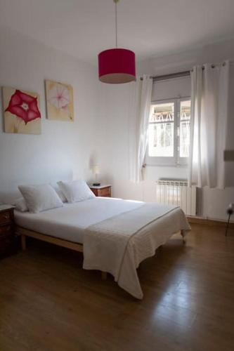 a bedroom with a large white bed in a room at casabelladona Barcelona in Barcelona