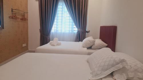 Ένα ή περισσότερα κρεβάτια σε δωμάτιο στο Anjung KLIA House 31 With Neflix