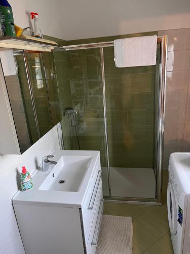a bathroom with a sink and a shower at konoba in Rab