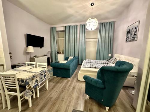 a living room with a couch and a table at Kings main square Apartment in Poprad