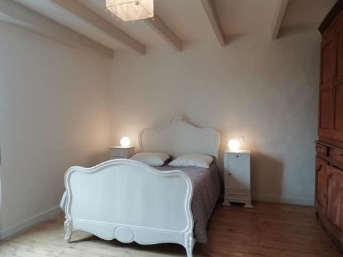 Postel nebo postele na pokoji v ubytování Quercy blanc maison en pierre