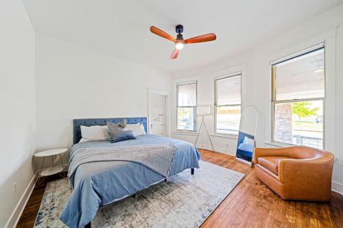 a bedroom with a bed and a ceiling fan at Boutique Home in Historic King William in San Antonio
