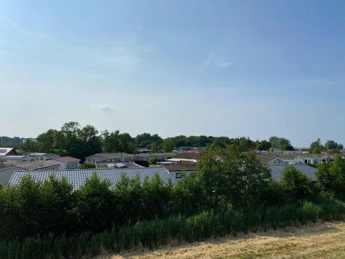 a view of a city with houses and trees at krabbenkreek 2 in Sint Annaland