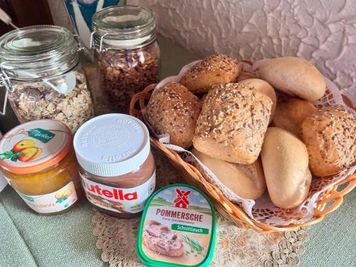 a basket of bread and other food items on a table at Landgasthof Zum Anker in Langenfeld