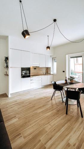 a kitchen and dining room with a table and chairs at Casa Monuriki in Rapallo