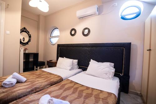 Postel nebo postele na pokoji v ubytování Votsalakia Hotel & Luxury Apartments