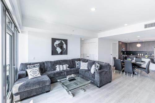 a living room with a couch and a table at Top Floor 3 Bed 3 Bath Penthouse Living In Luxury in Los Angeles