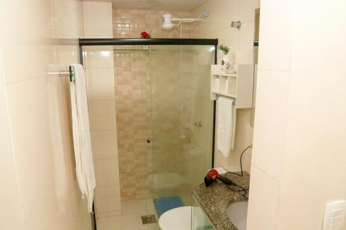 a bathroom with a shower with a glass door at A 5 km do aeroporto no centro do Nucleo Bandeirante 156 in Brasilia