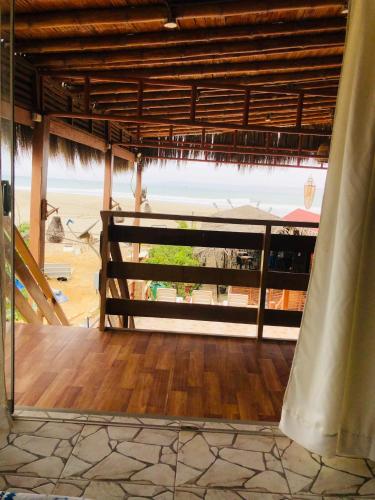 a view of the beach from the porch of a beach house at Casa Lobos in Lobitos