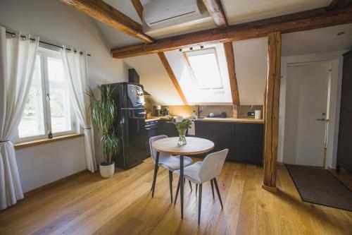 a kitchen with a table and chairs in a room at Jüri tn Apartment B in Võru